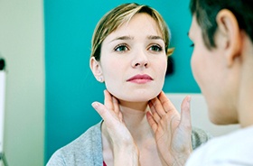 Dental team member looking at patient’s lymph nodes