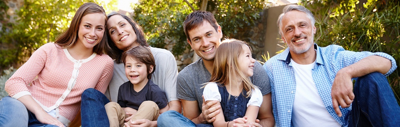 Smiling family with grandparents and young children